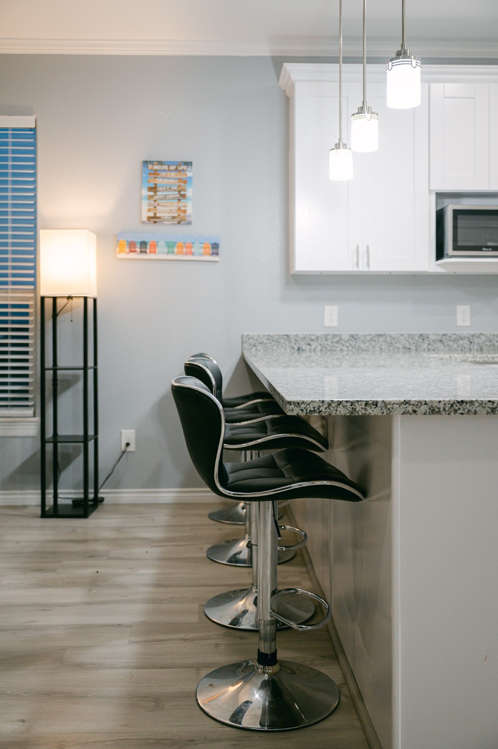 305 Jettyview Road, Unit A Surfside Beach, TX 77541 - Photo 36 of 41 a kitchen with a sink cabinets and wooden floor