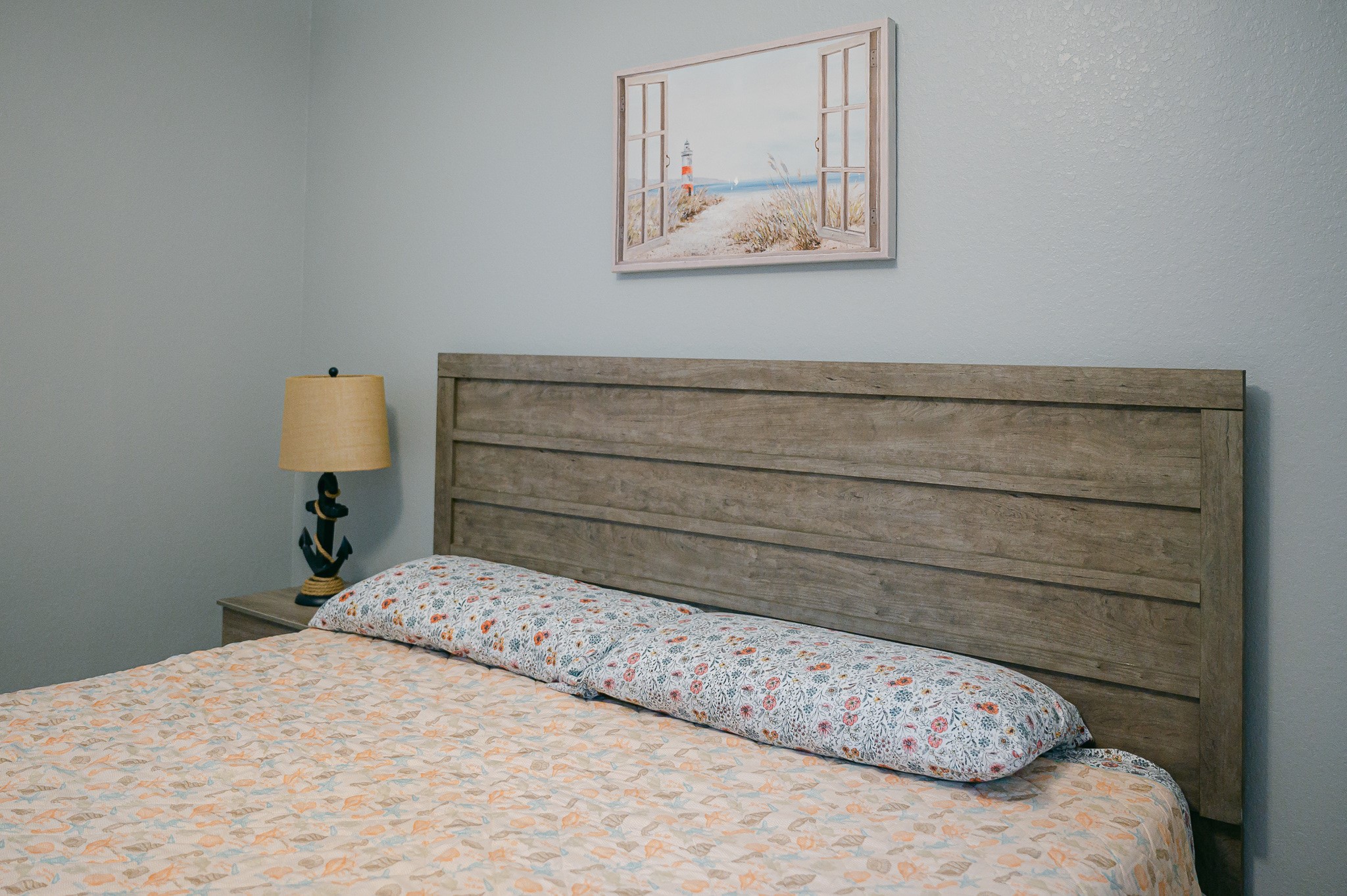 305 Jettyview Road, Unit A Surfside Beach, TX 77541 - Photo 37 of 41 a bedroom with a bed and wall painting