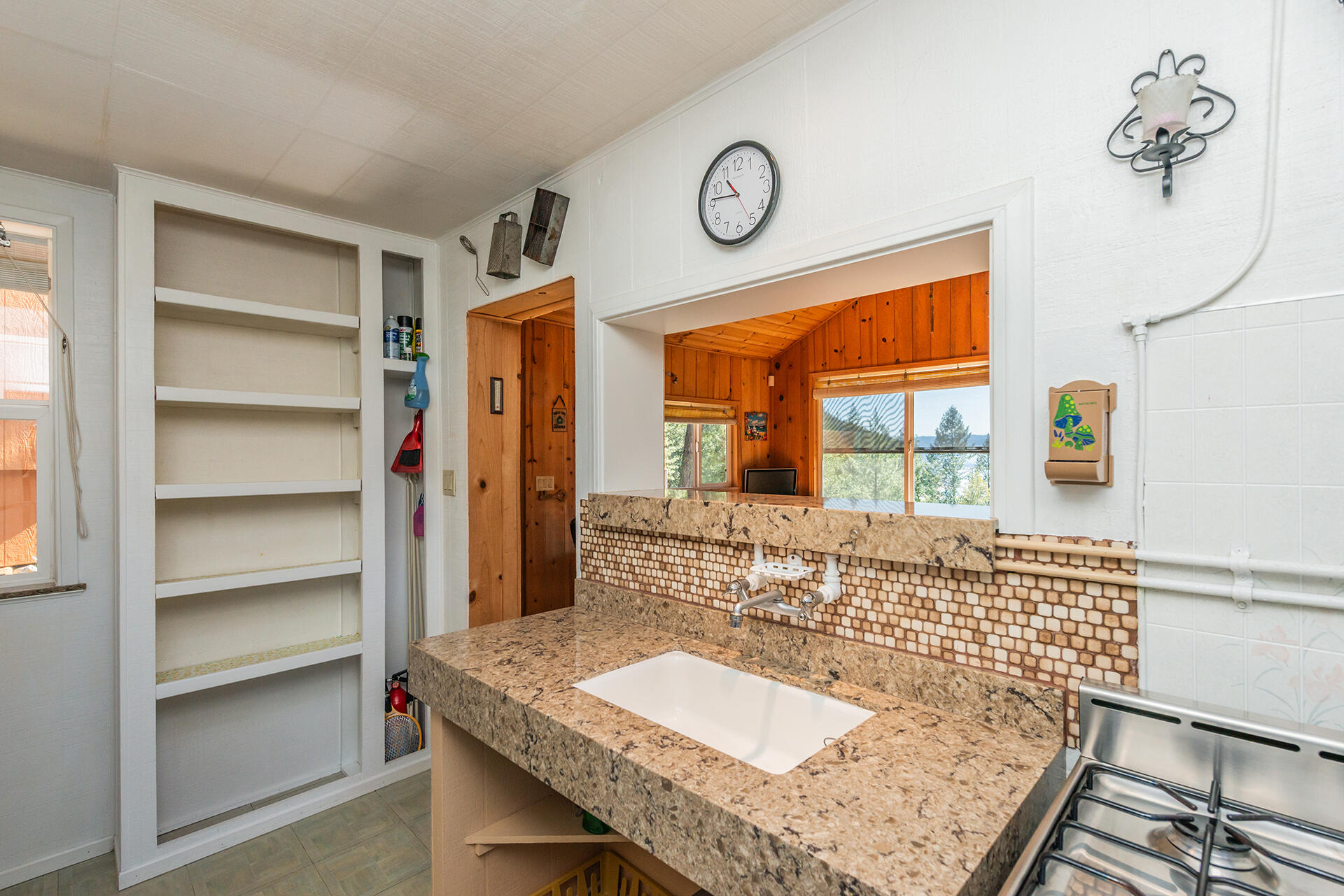 8341 East Side Road Trinity Center, CA 96091 - Photo 16 of 79 a bath room with a table and a clock