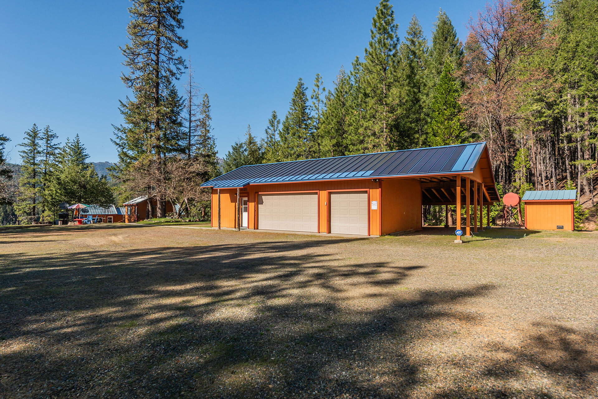 8341 East Side Road Trinity Center, CA 96091 - Photo 37 of 79 a front view of a house with a yard and garage