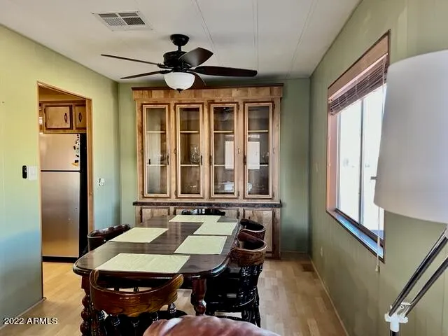 a room with furniture pool table and window