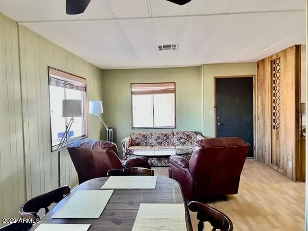 a living room with furniture and a window