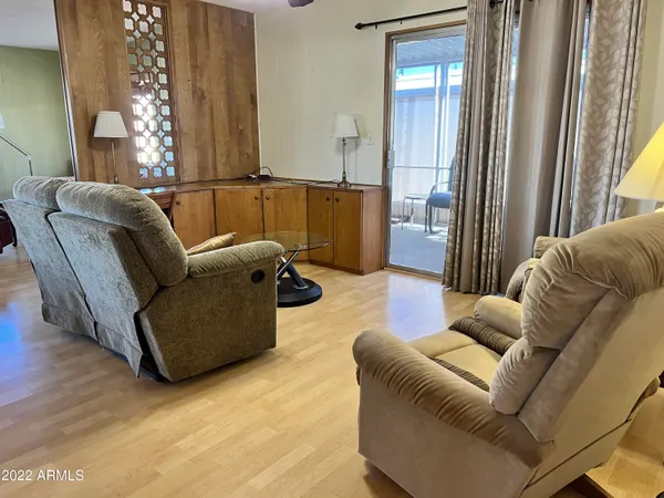 a living room with furniture and a window