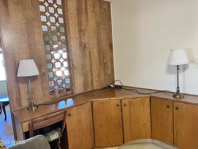 a living room with a bed furniture and a window