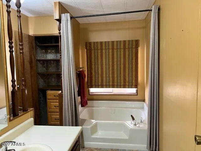 a bathroom with a bathtub and a shower