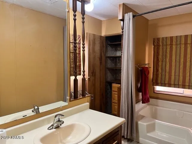 a bathroom with a toilet and a shower curtain