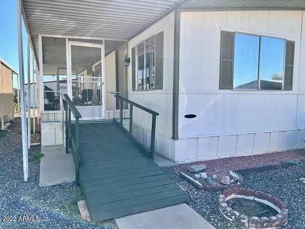 a balcony with table and chairs