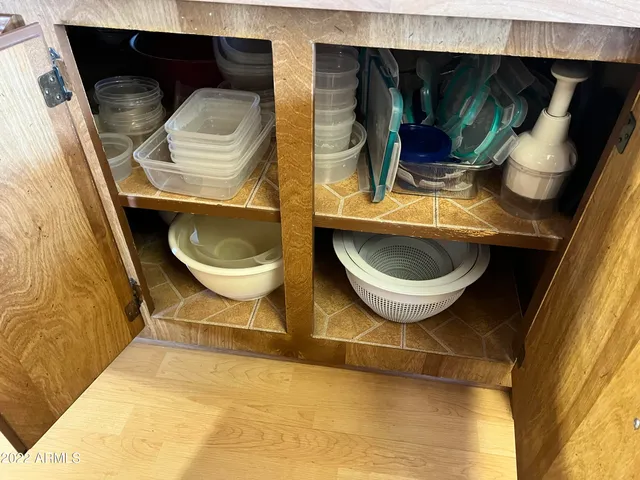 a bathroom with a toilet and a mirror