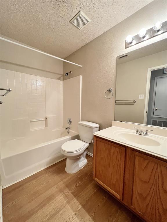 2217 Lookout Lane Denton, TX 76207 - Photo 11 of 18 a bathroom with a sink a toilet and shower