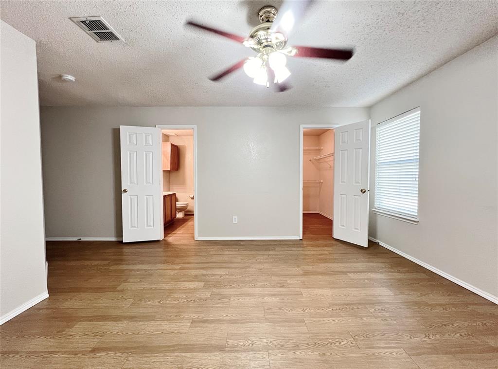 2217 Lookout Lane Denton, TX 76207 - Photo 16 of 18 an empty room with fan and windows