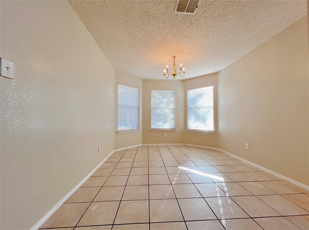 2217 Lookout Lane Denton, TX 76207 - Photo 3 of 18 a view of an empty room with a window