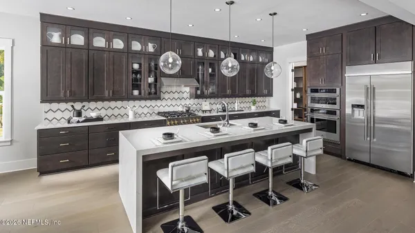 a kitchen with a table and chairs in it