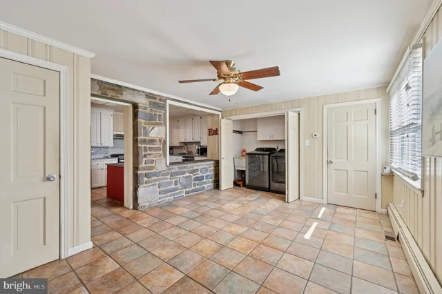 a view of a kitchen with furniture and a kitchen