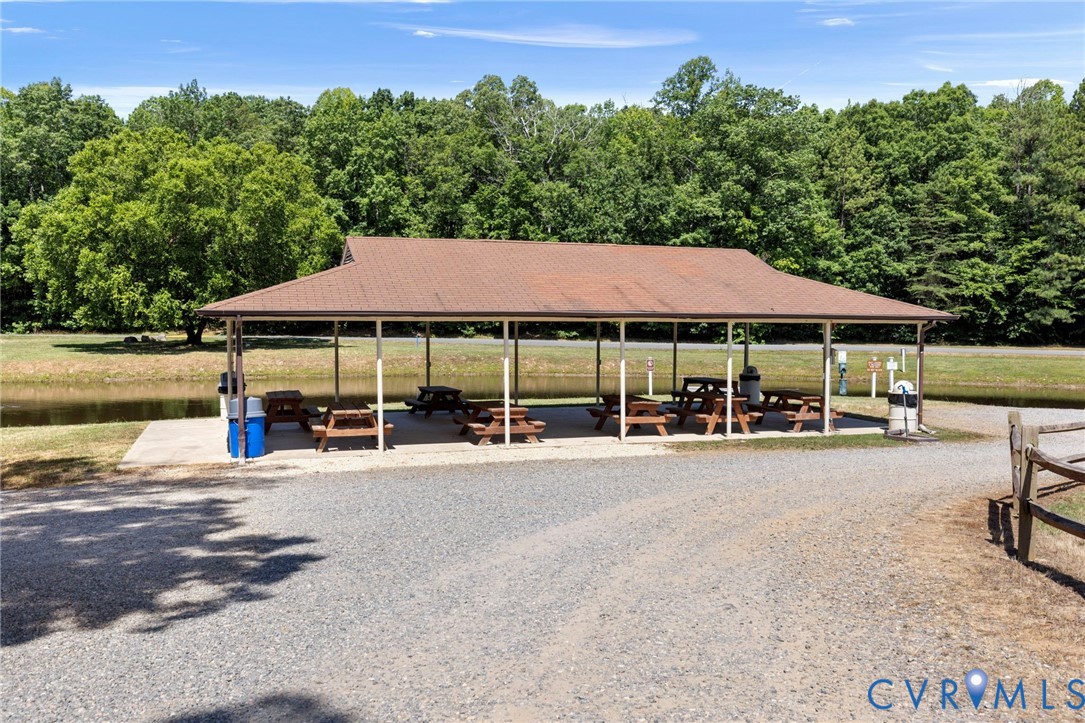 204 Village Court Ruther Glen, VA 22546 - Photo 23 of 27 a view of a house with garden and sitting area