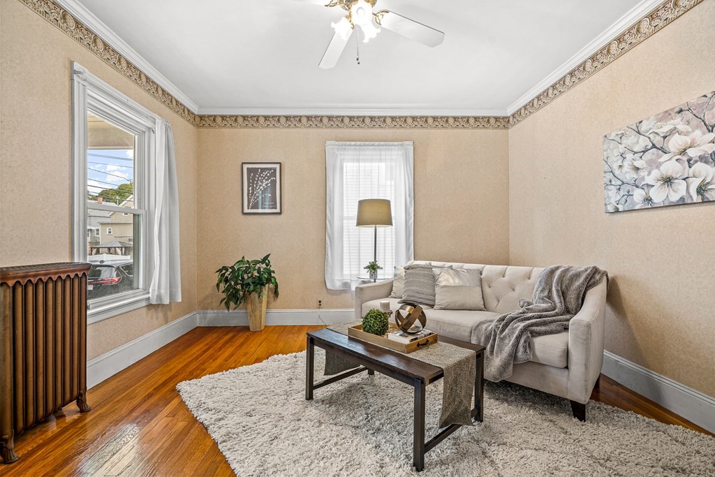 14 Hancock Street Stoneham, MA 02180 - Photo 11 of 38 a living room with furniture and a rug