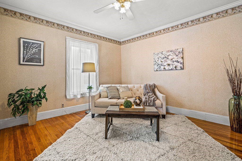 14 Hancock Street Stoneham, MA 02180 - Photo 12 of 38 a living room with furniture and a potted plant