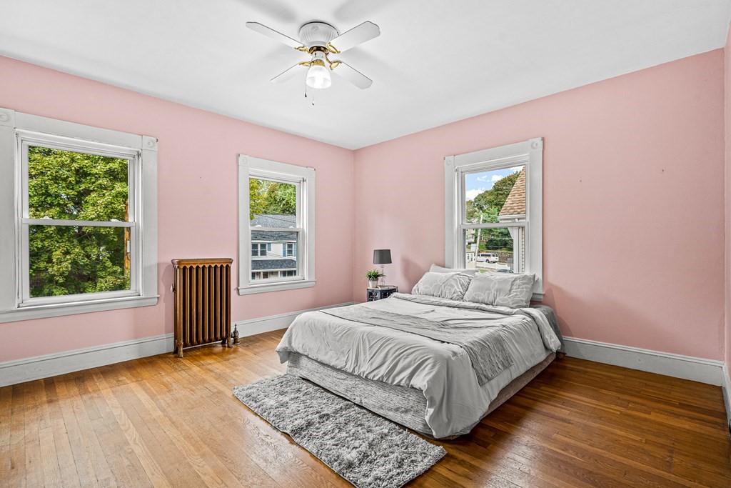 14 Hancock Street Stoneham, MA 02180 - Photo 16 of 38 a bedroom with a bed and a window