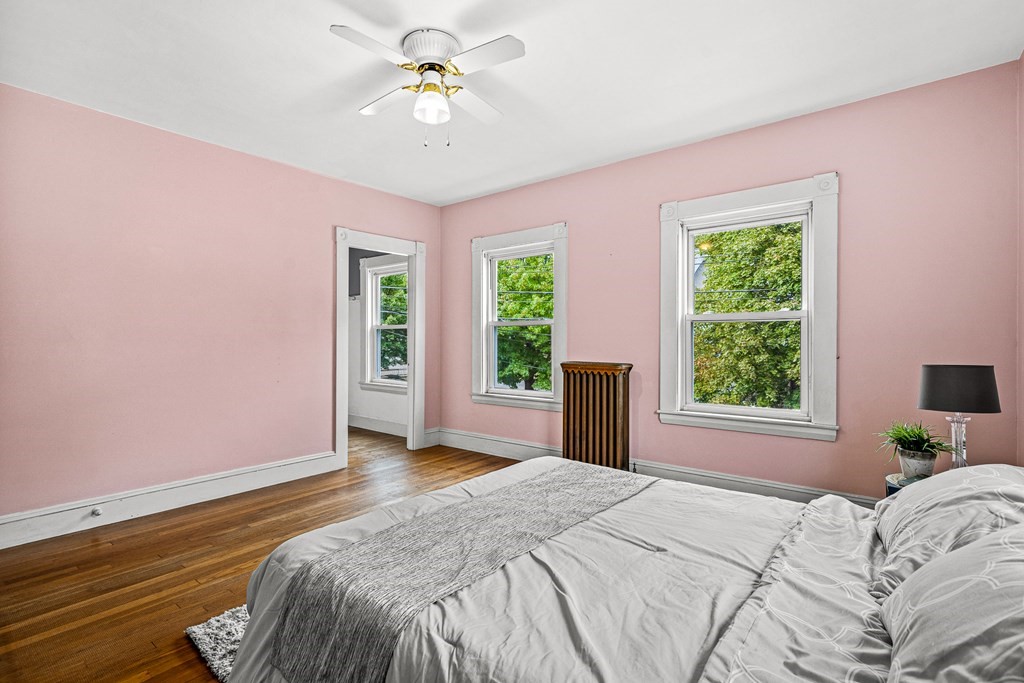 14 Hancock Street Stoneham, MA 02180 - Photo 19 of 38 a bedroom with a bed and a window