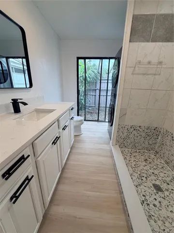 a bathroom with a sink and mirror