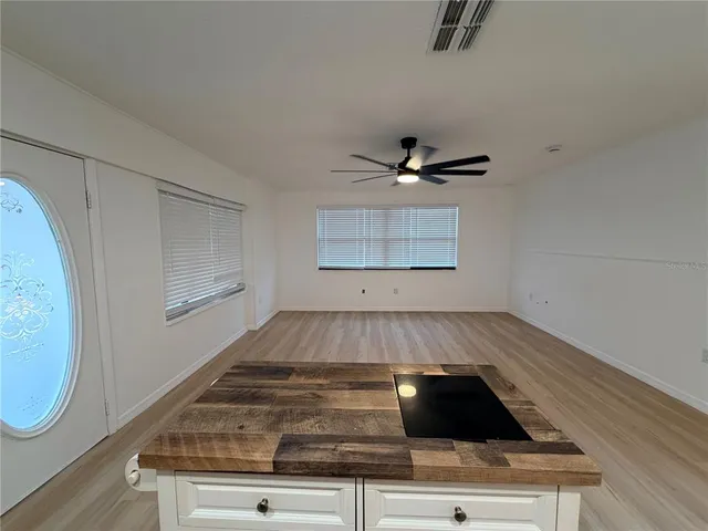 a view of a electric appliances in kitchen and wooden floor