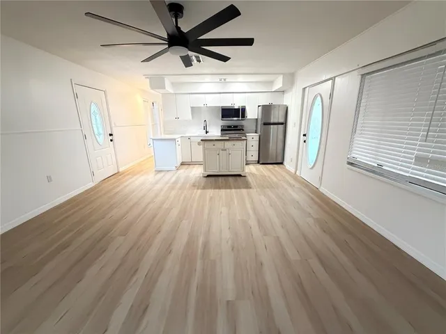 a bathroom with a sink a toilet and a shower