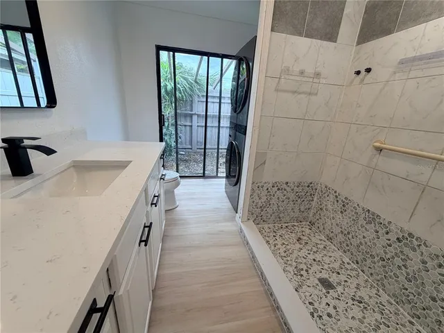 a view of a hallway with washer and dryer