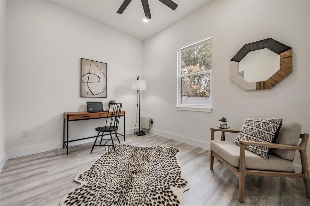 2305 West Kentucky Avenue Tampa, FL 33607 - Photo 16 of 26 a living room with furniture a rug and a window