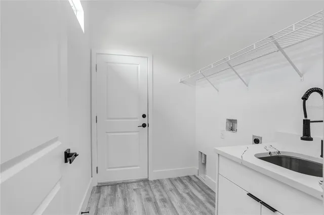 a view of a bathroom with a sink and mirror