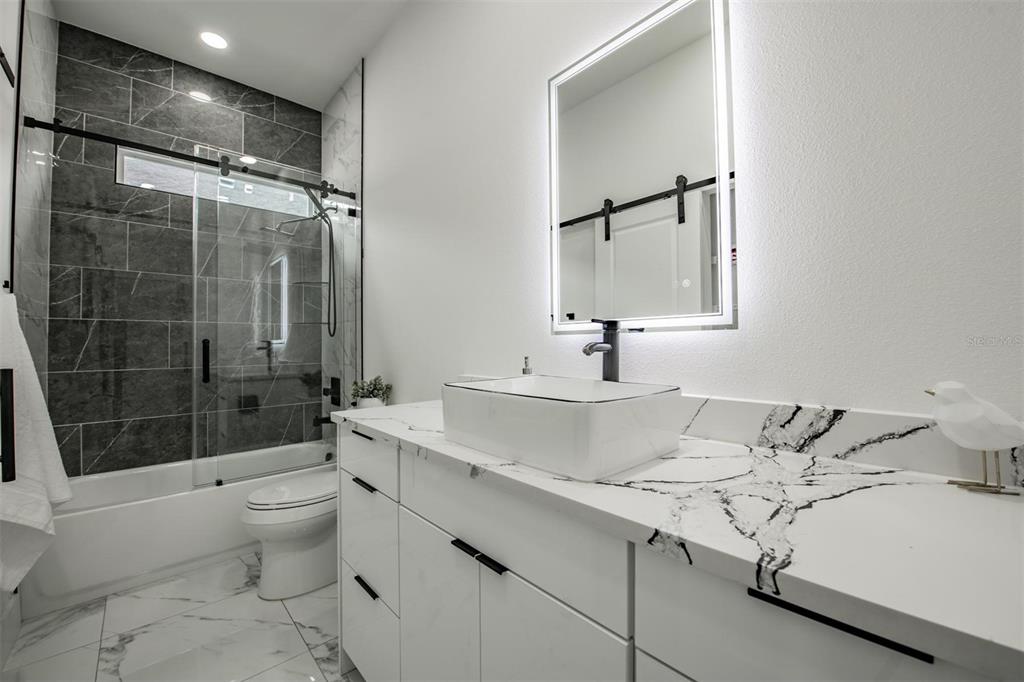 2305 West Kentucky Avenue Tampa, FL 33607 - Photo 19 of 26 a bathroom with a sink toilet and shower