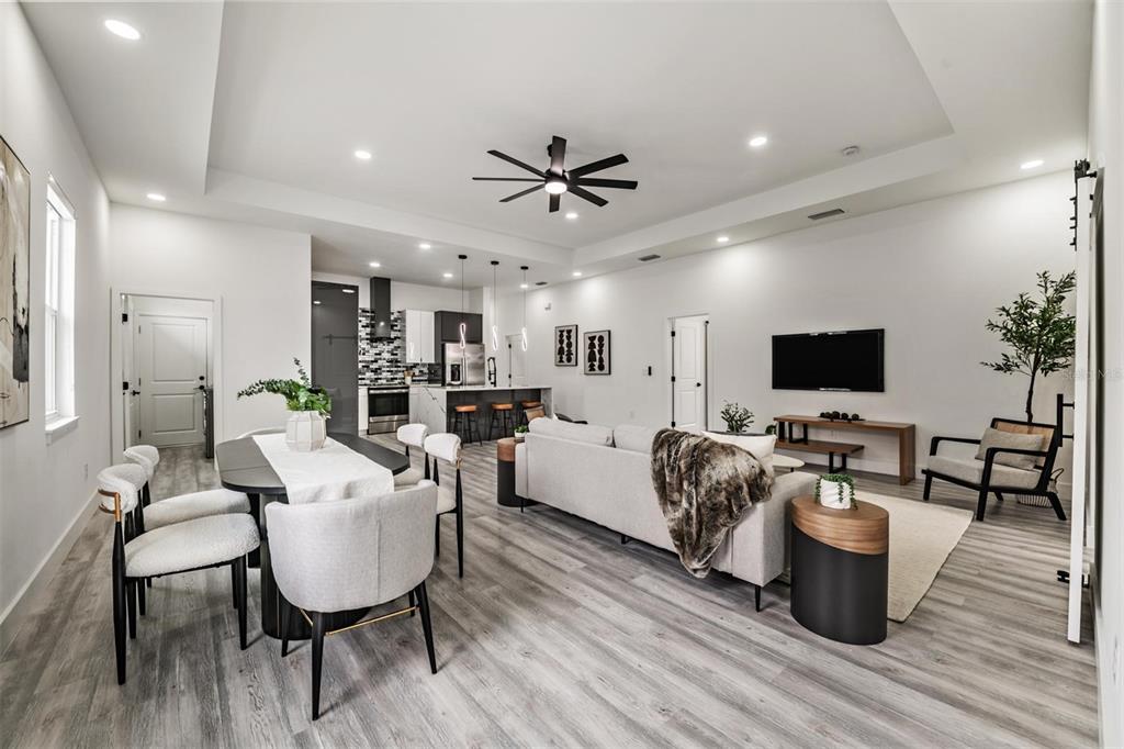 2305 West Kentucky Avenue Tampa, FL 33607 - Photo 5 of 26 a living room with furniture wooden floor and a flat screen tv