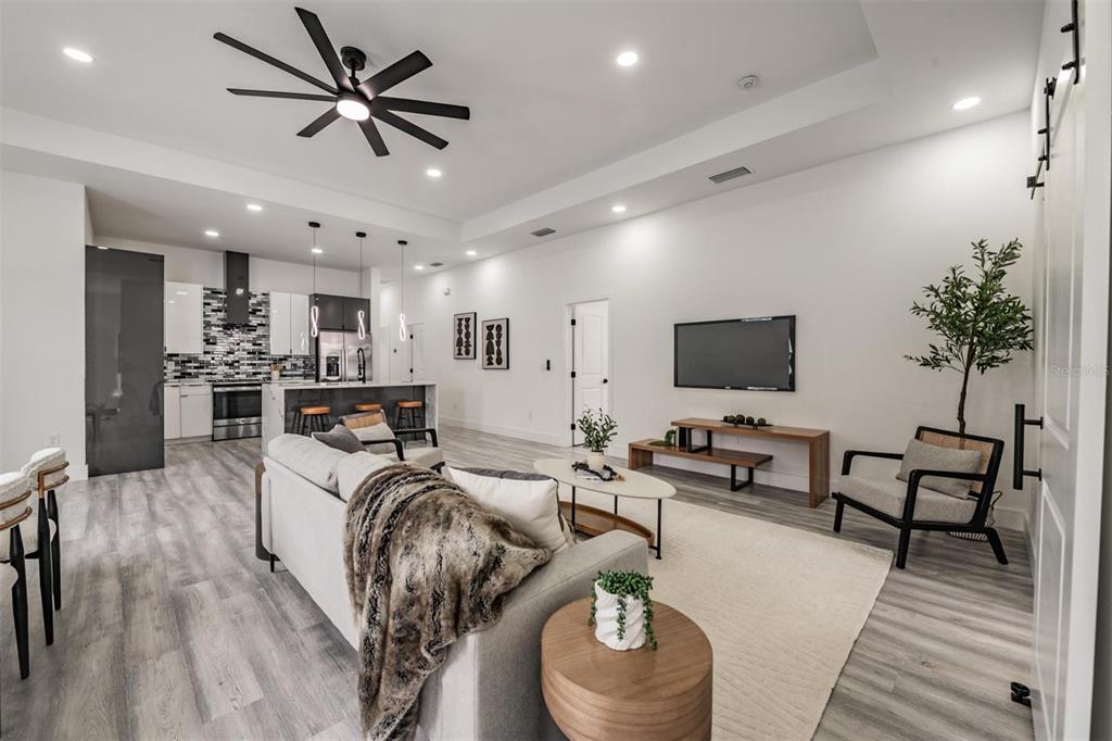 2305 West Kentucky Avenue Tampa, FL 33607 - Photo 6 of 26 a living room with furniture and a flat screen tv