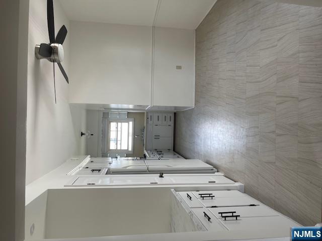 99 Union Avenue, Unit 2 Garfield, NJ 07026 - Photo 5 of 14 a view of empty room with wooden floor and fan