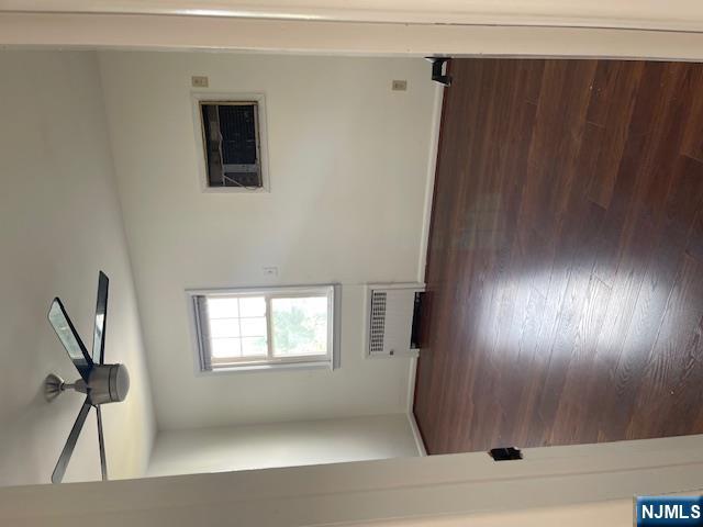 99 Union Avenue, Unit 2 Garfield, NJ 07026 - Photo 10 of 14 a view of a livingroom with wooden floor and a ceiling fan