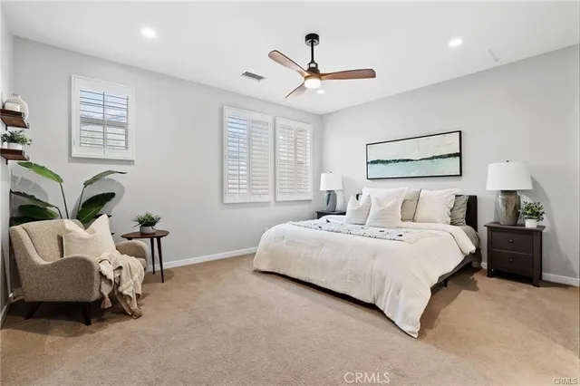 a bedroom with bed and window