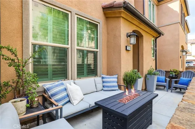 a outdoor living space with furniture and a potted plant