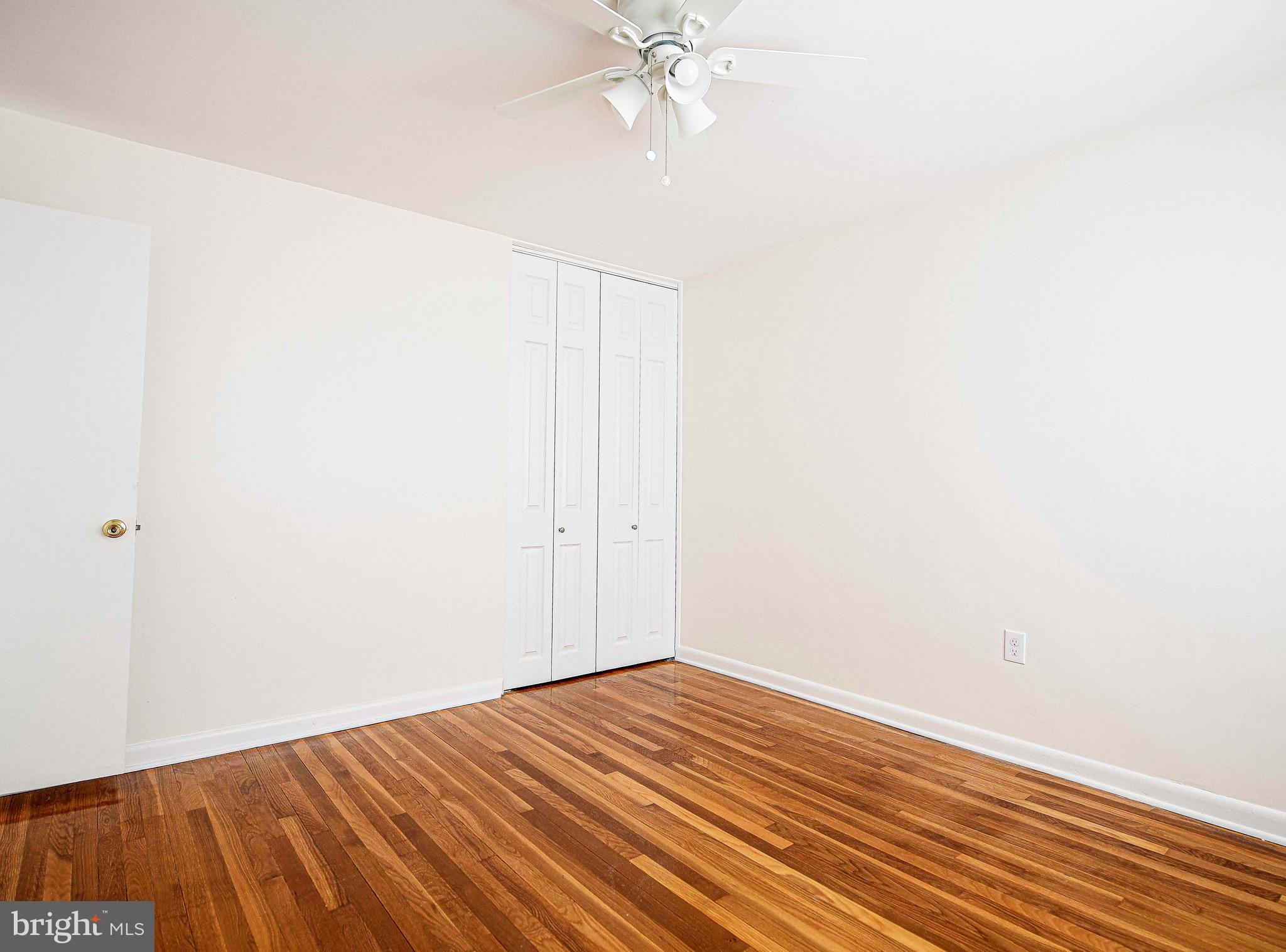 8559 Morven Road Baltimore, MD 21234 - Photo 16 of 27 a view of an empty room with wooden floor