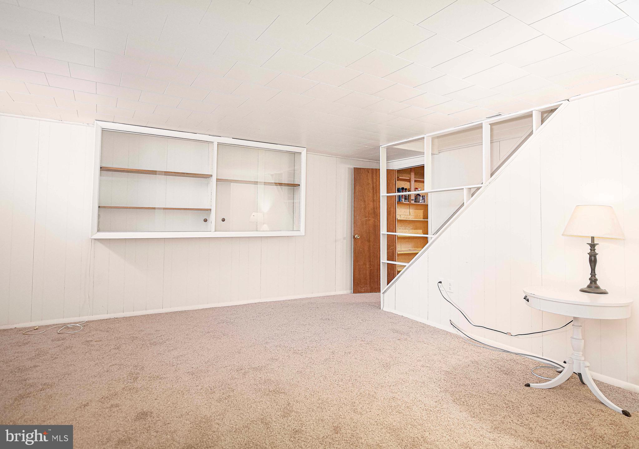 8559 Morven Road Baltimore, MD 21234 - Photo 19 of 27 a view of an empty room with a window