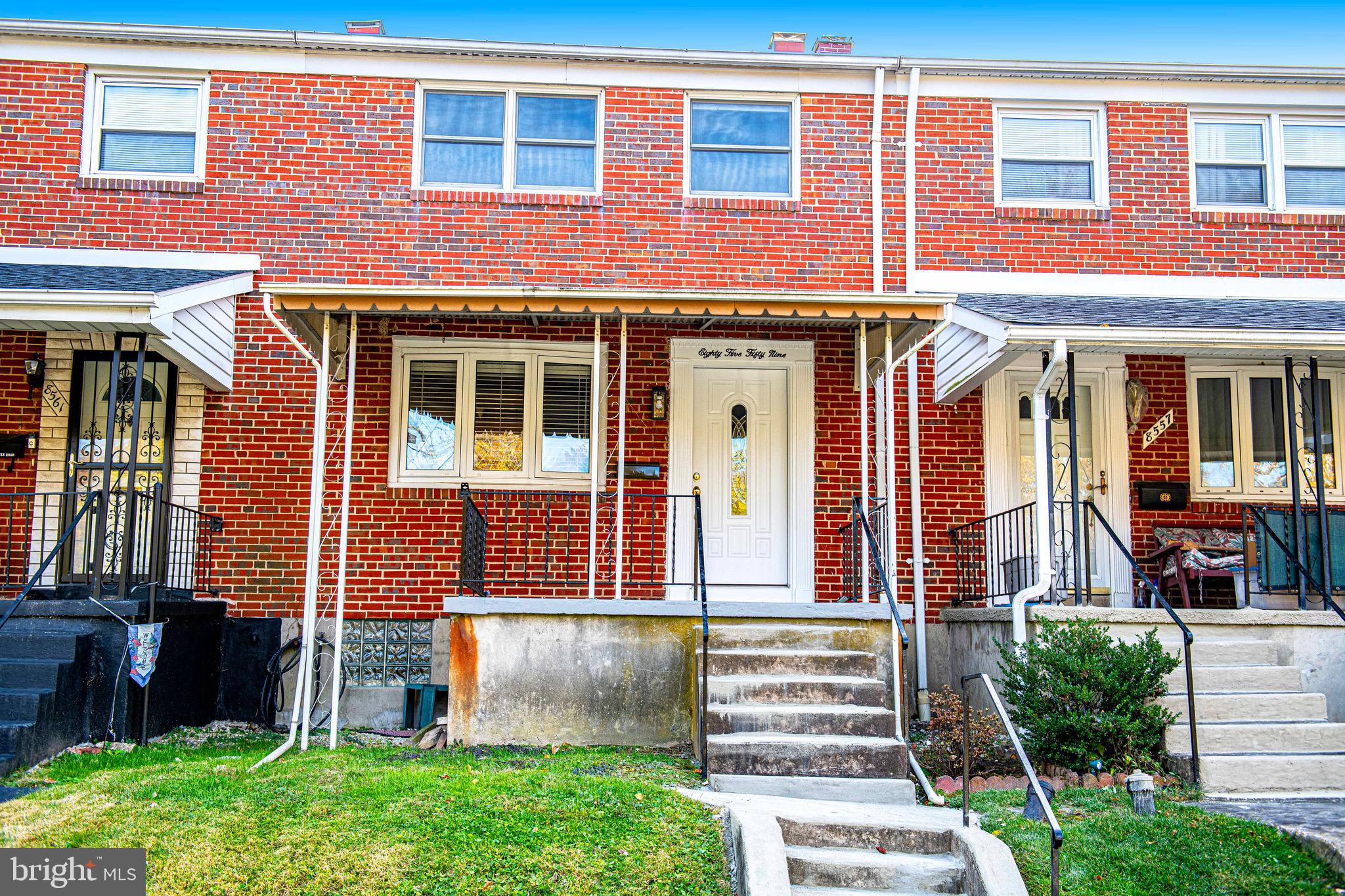 8559 Morven Road Baltimore, MD 21234 - Photo 2 of 27 front view of a brick house with a small yard
