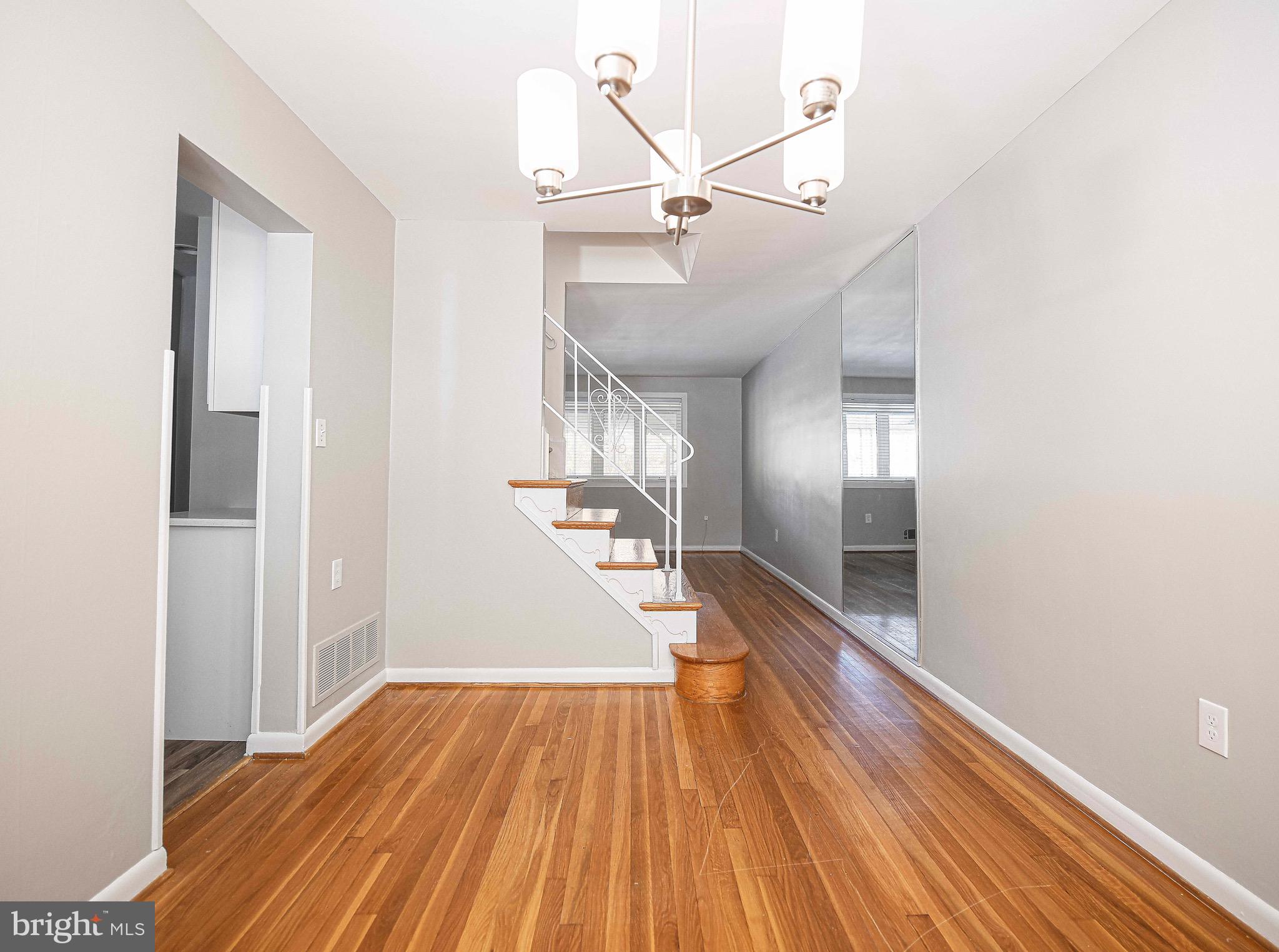 8559 Morven Road Baltimore, MD 21234 - Photo 9 of 27 a view of a hallway view with wooden floor