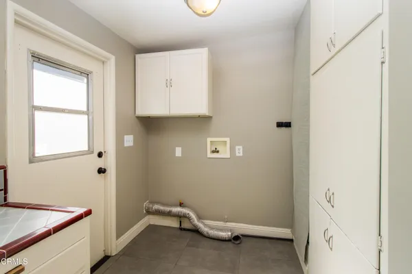 a room with a window and a ceiling fan