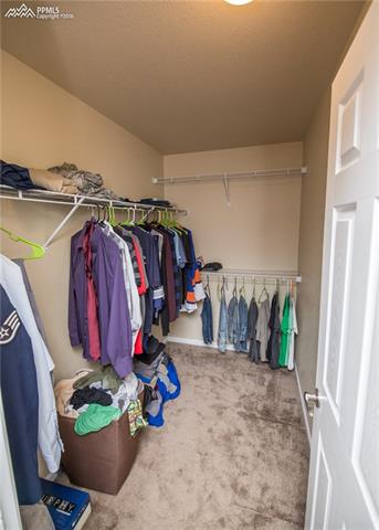 7945 Morning Dew Road Colorado Springs, CO 80908 - Photo 25 of 32 Master walk-in closet is huge!
