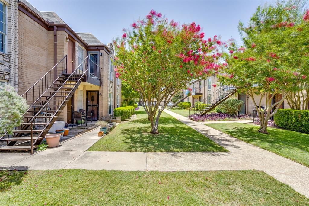 4102 Ridglea Country Club Drive, Unit 1503 Fort Worth, TX 76126 - Photo 16 of 21 Building exterior featuring brick and stone cladding, individual balconies, and metal staircases