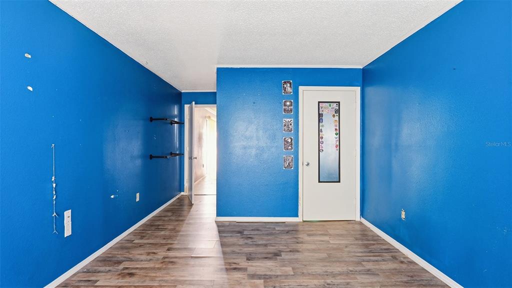 10565 Bessemer Street New Port Richey, FL 34654 - Photo 65 of 72 a view of hallway with wooden floor