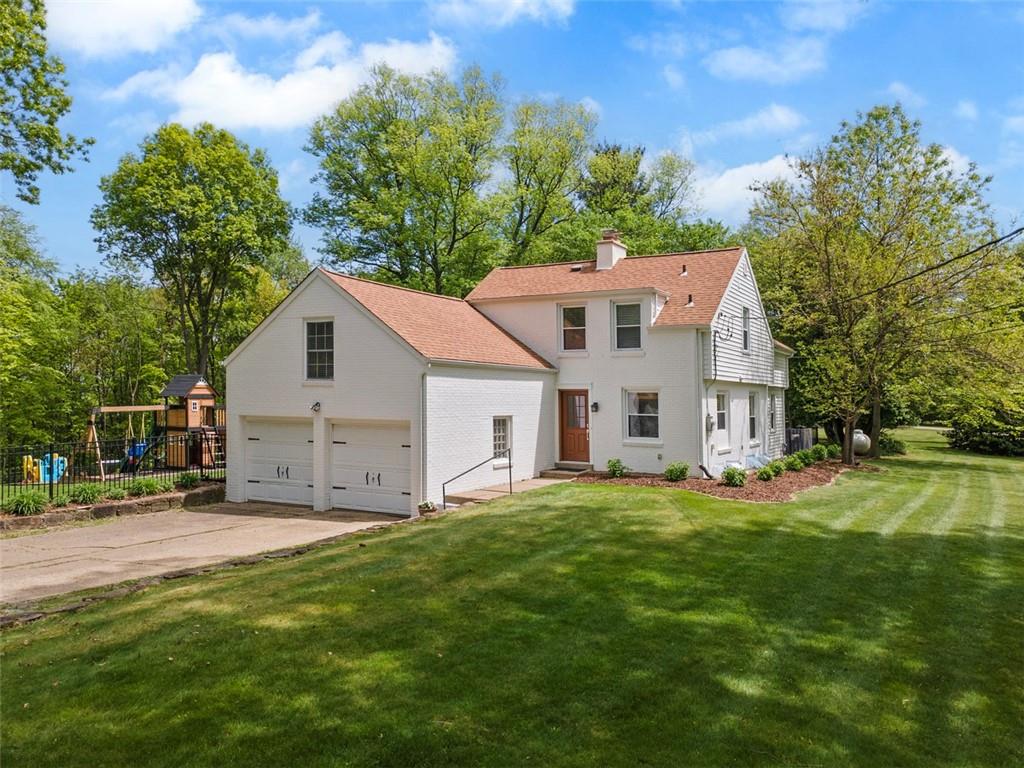 a view of a house with a yard