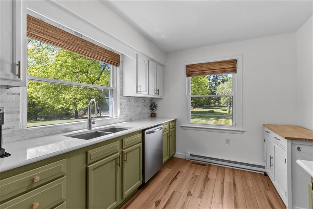 3566 Green Garden Road Aliquippa, PA 15001 - Photo 11 of 50 a kitchen with a sink window and cabinets