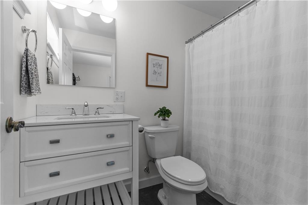 3566 Green Garden Road Aliquippa, PA 15001 - Photo 17 of 50 a bathroom with a sink a toilet and a mirror