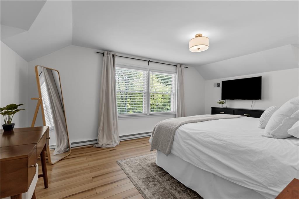 3566 Green Garden Road Aliquippa, PA 15001 - Photo 23 of 50 a bedroom with a bed and a flat screen tv