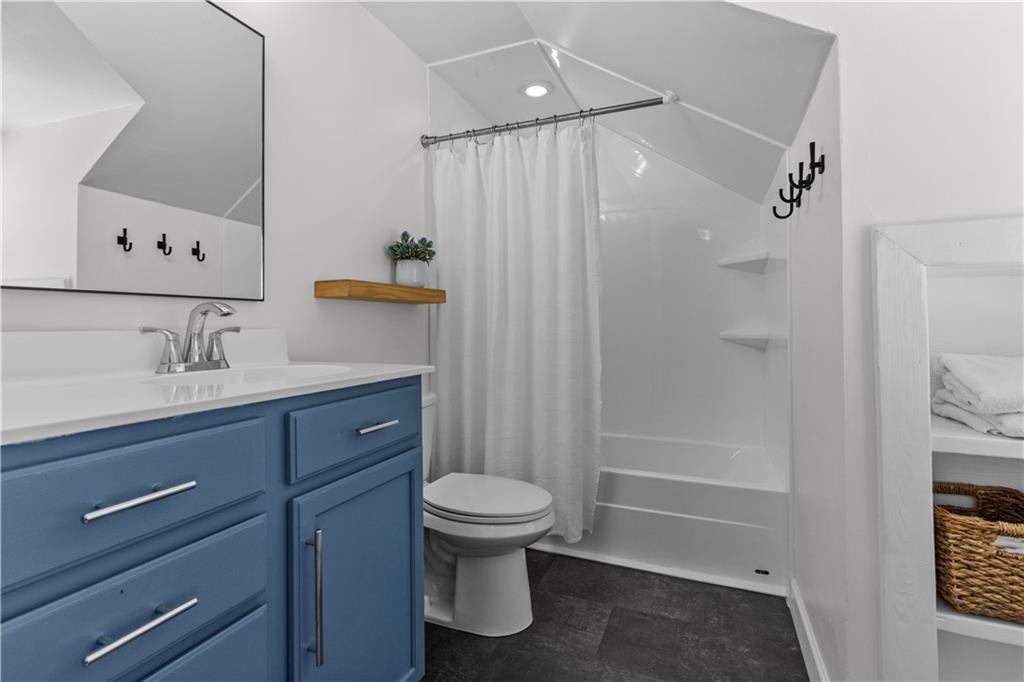 3566 Green Garden Road Aliquippa, PA 15001 - Photo 30 of 50 a bathroom with a sink a toilet and shower