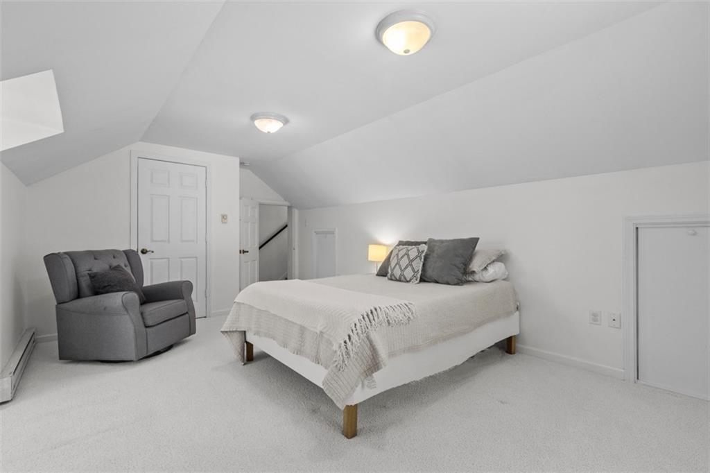3566 Green Garden Road Aliquippa, PA 15001 - Photo 32 of 50 a spacious bedroom with a bed and a couch