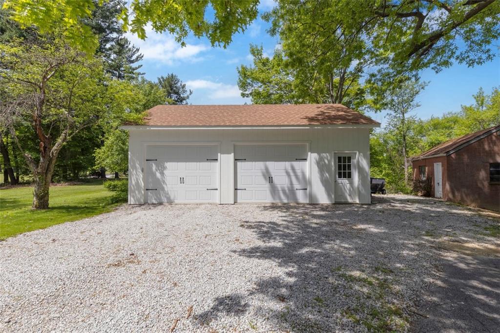 3566 Green Garden Road Aliquippa, PA 15001 - Photo 39 of 50 a house with a tree in front of it
